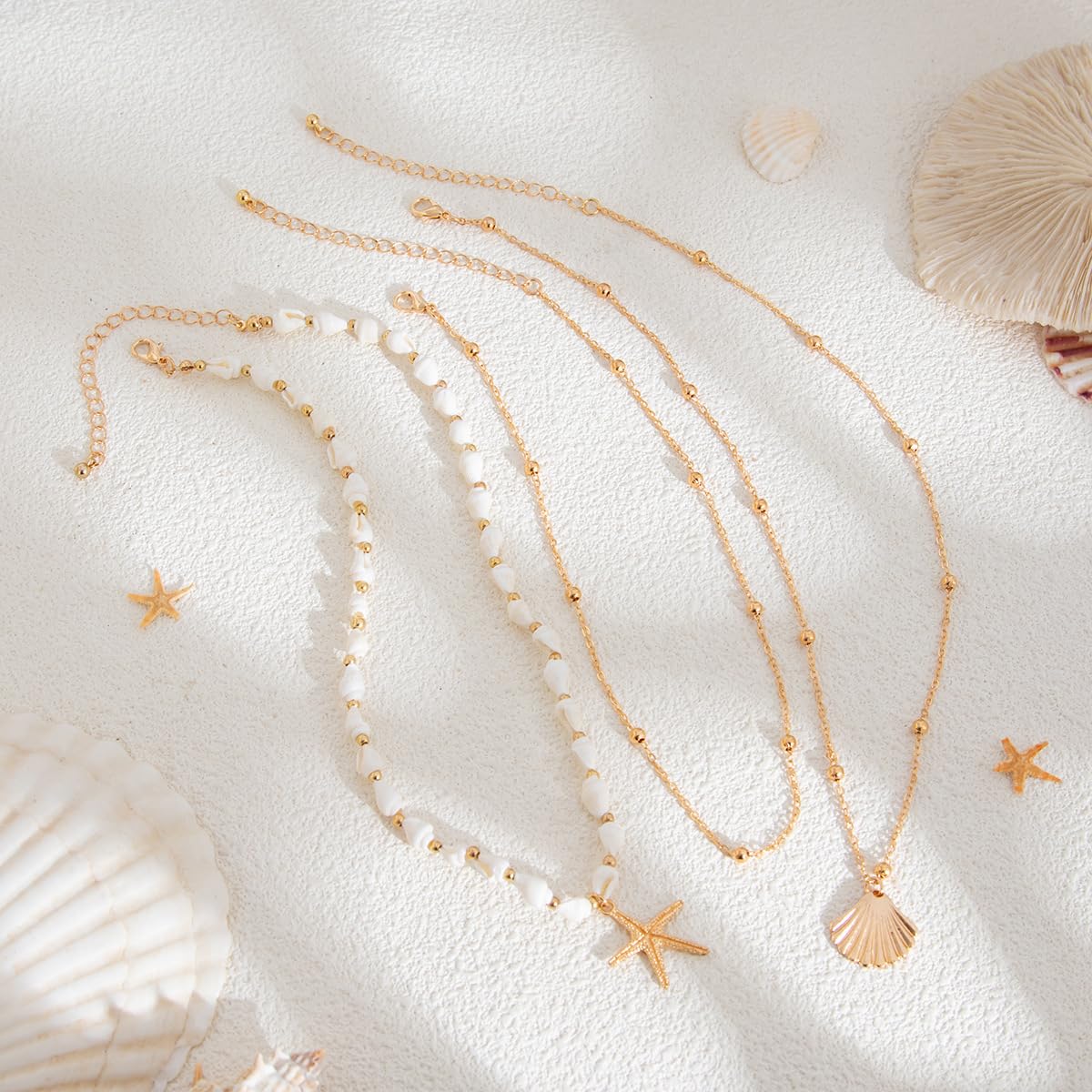 GYRMMUE Gold Starfish Necklaces for Women Boho Seashell Pendant Layered Necklaces Set Dainty Ocean Beach Charm Necklace Hawaiian Shell Stackable Beaded Necklace Summer Vacation Jewelry (White)