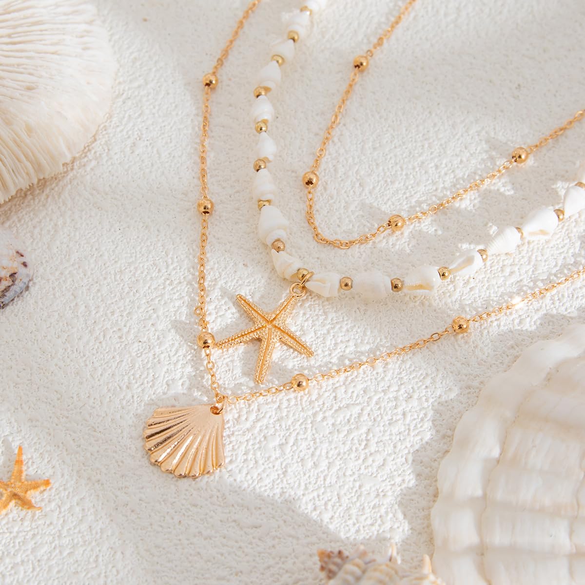 GYRMMUE Gold Starfish Necklaces for Women Boho Seashell Pendant Layered Necklaces Set Dainty Ocean Beach Charm Necklace Hawaiian Shell Stackable Beaded Necklace Summer Vacation Jewelry (White)